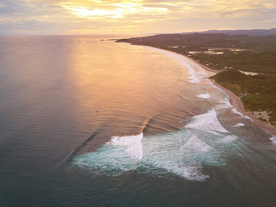 Famous bay for surf on Nicaragua aerial drone view on sunset time