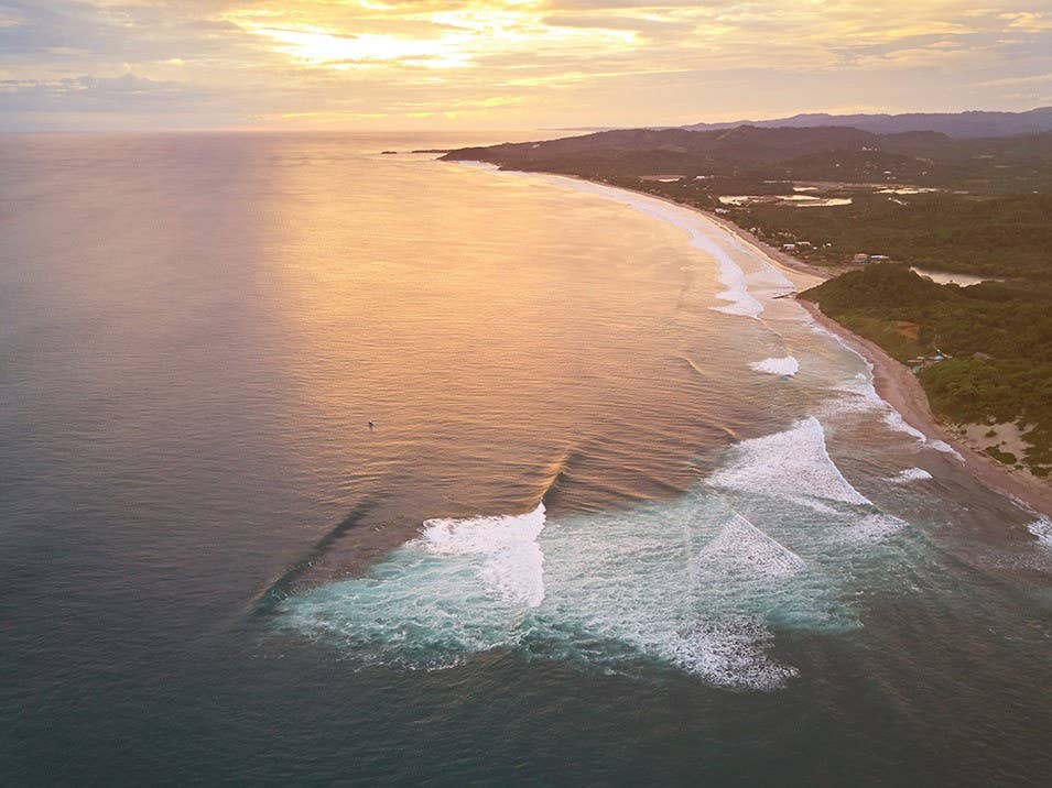 1251191 Famous bay for surf on Nicaragua Famous bay for surf on Nicaragua aerial drone view on sunset time
