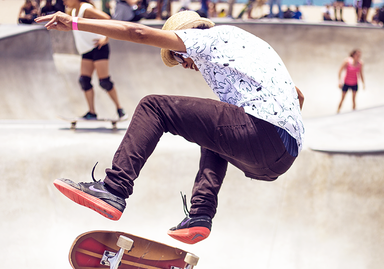 Skateboard trick in park