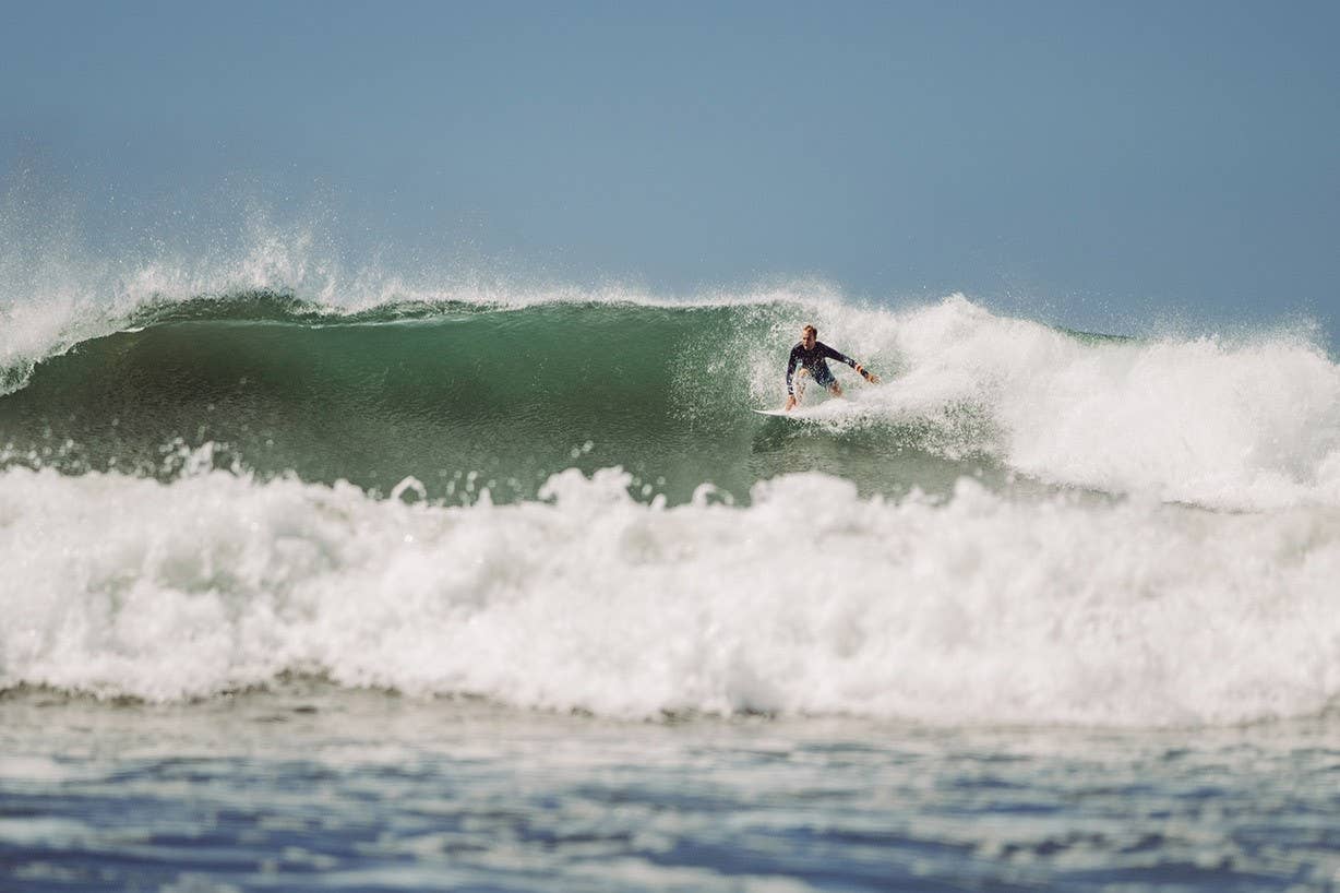 Guy surfing in Costa Rica