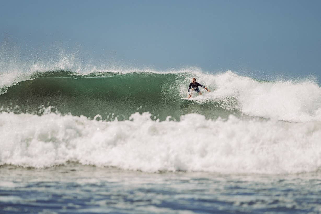 Guy surfing in Costa Rica Guy surfing in Costa Rica