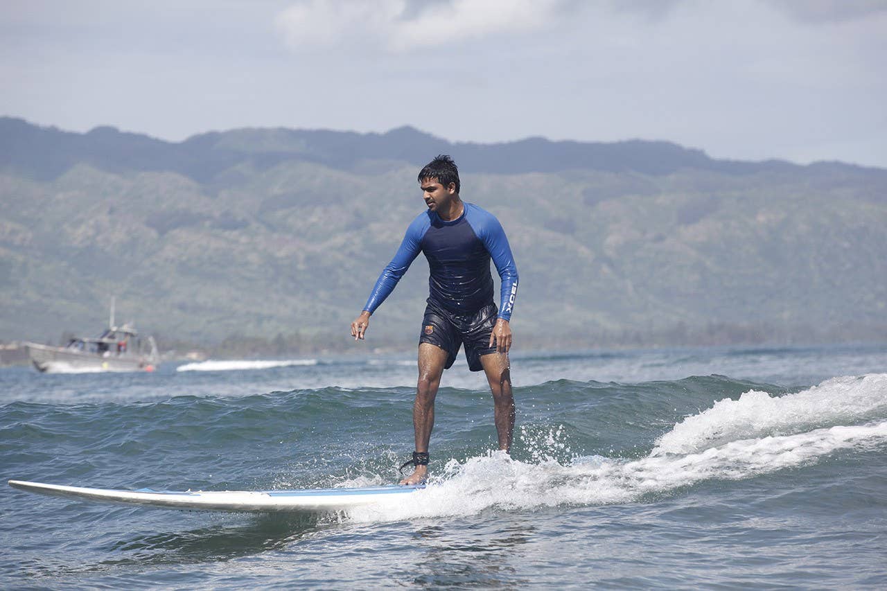 A student hangs 10 in Costa Rica's famous surf breaks