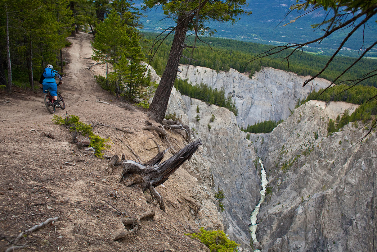 A young male mountain biker riding the Moonraker cross country trail system near Golden, BC