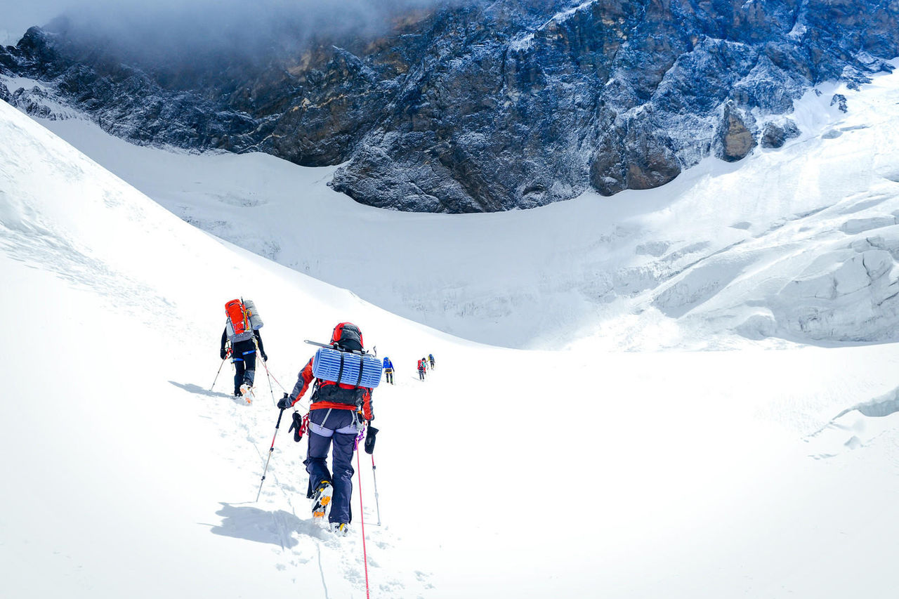 Group of climbers reaching the summit. Nepal